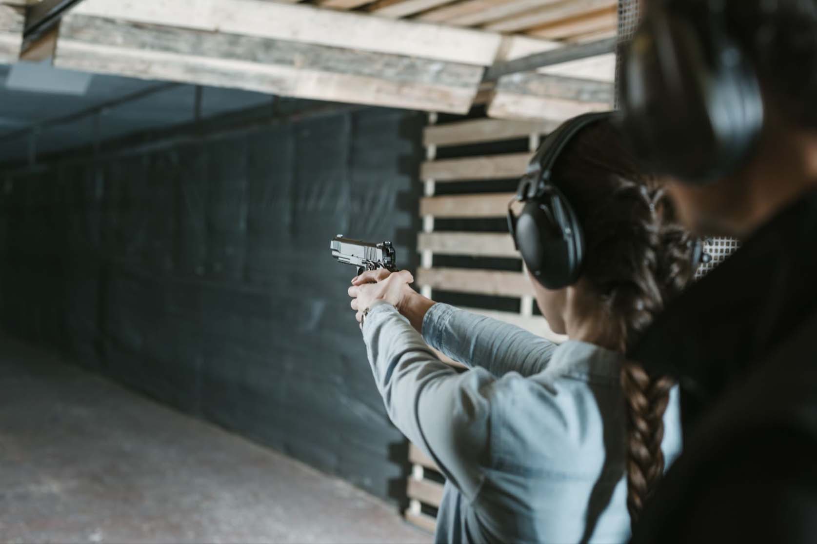 Woman training in a gun range.